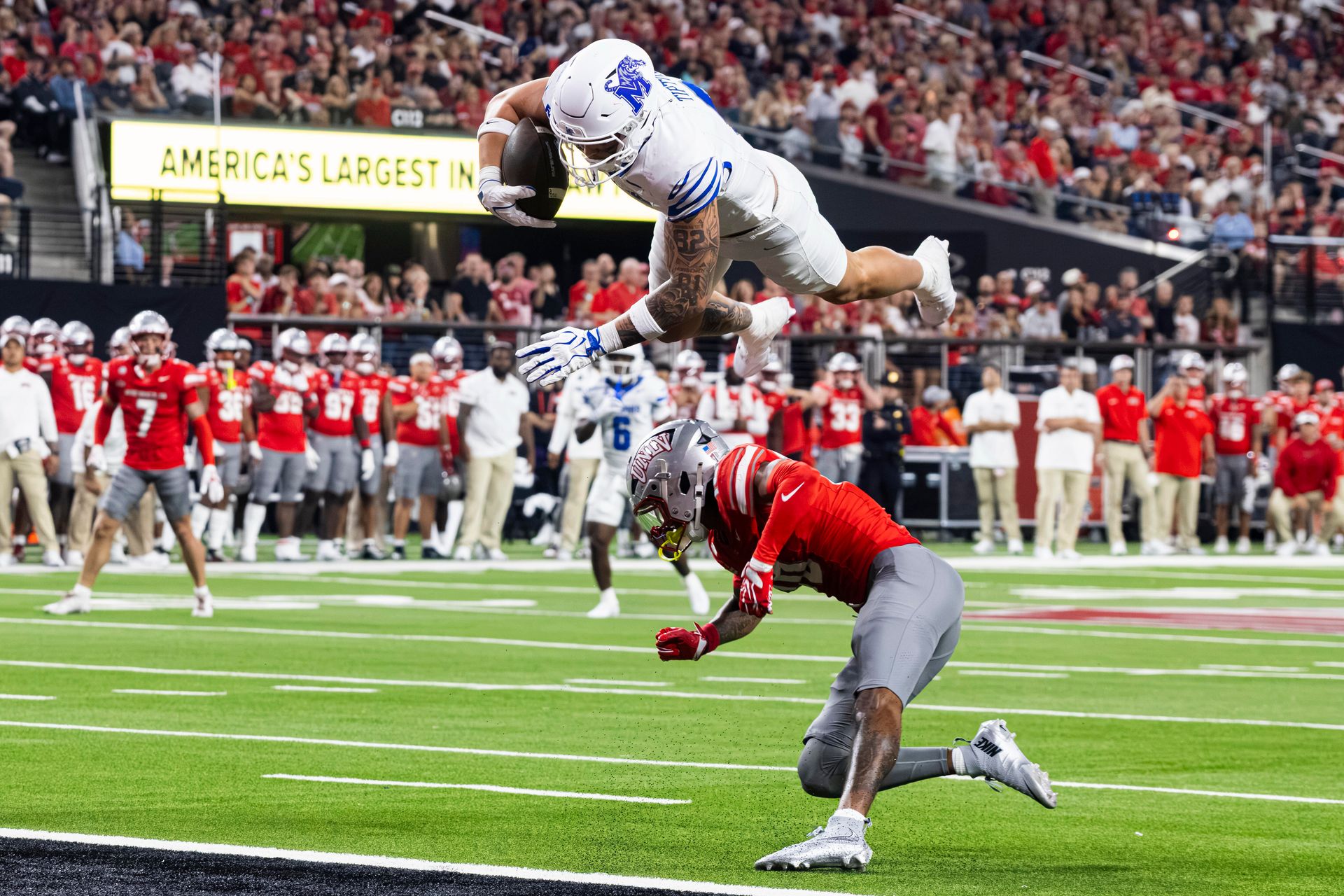 Hunter Tipton hurdles a player for a touchdown