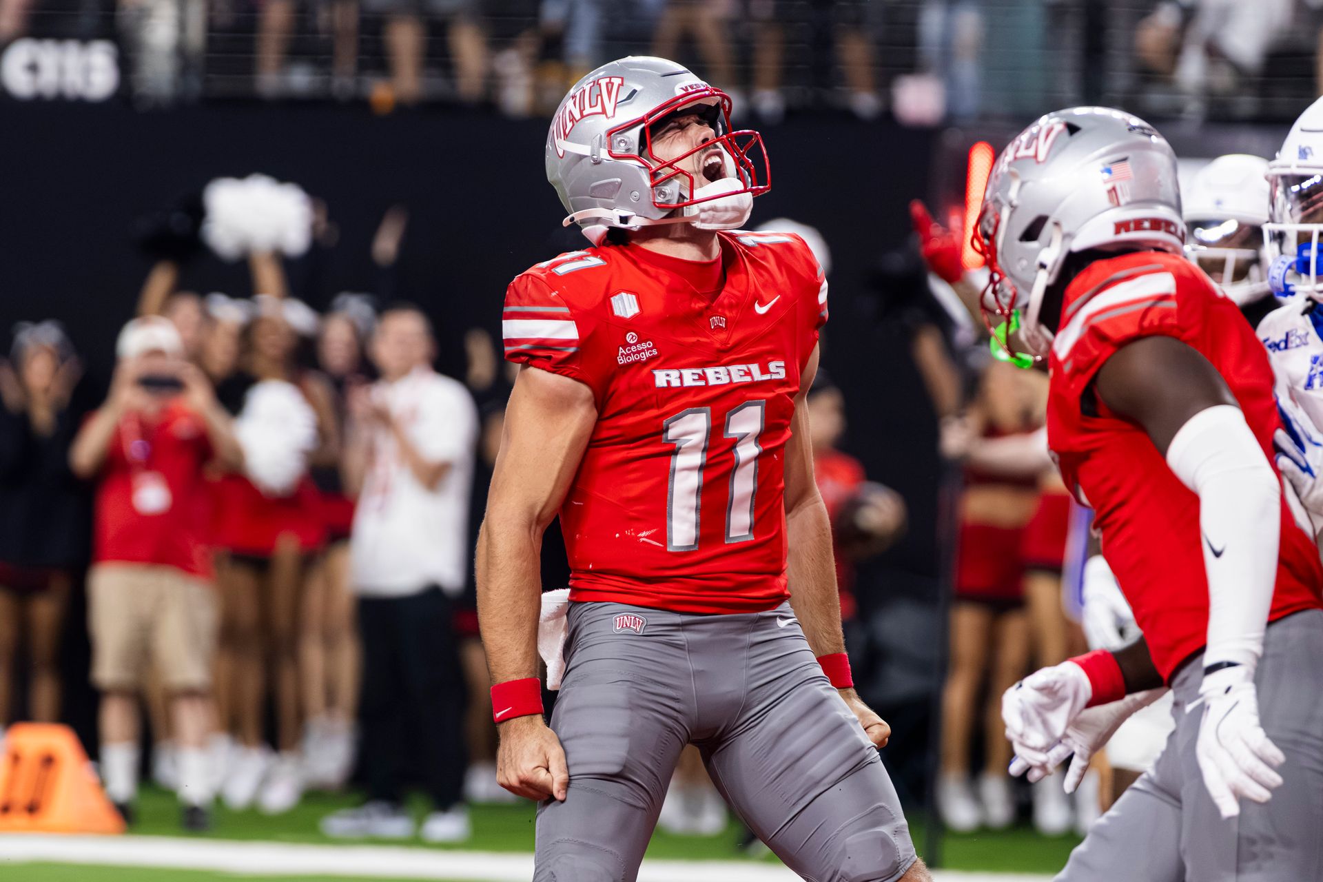 Jackson Arnold celebrates a rushing touchdown