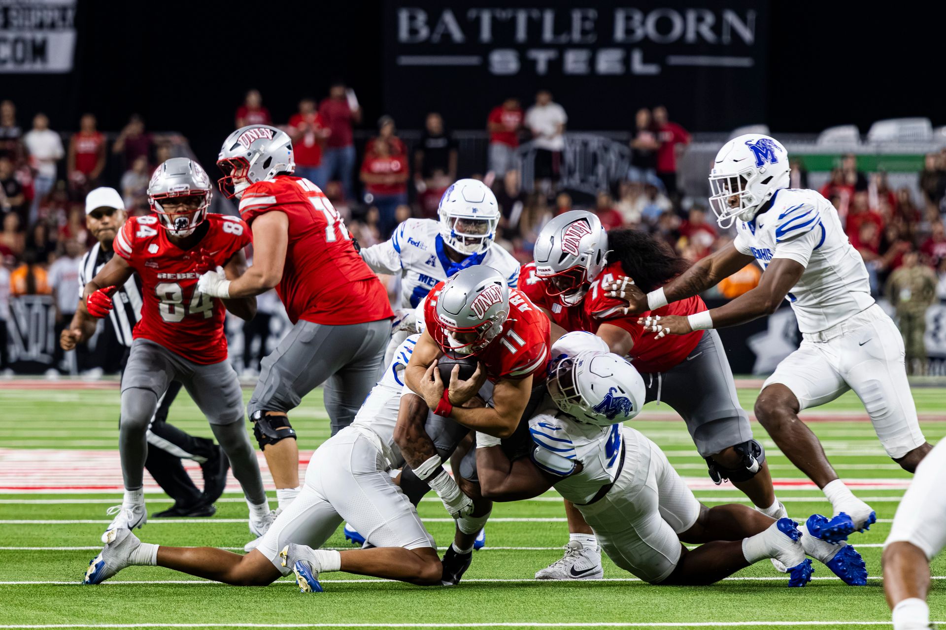 Jackson Arnold tackled during a rush attempt