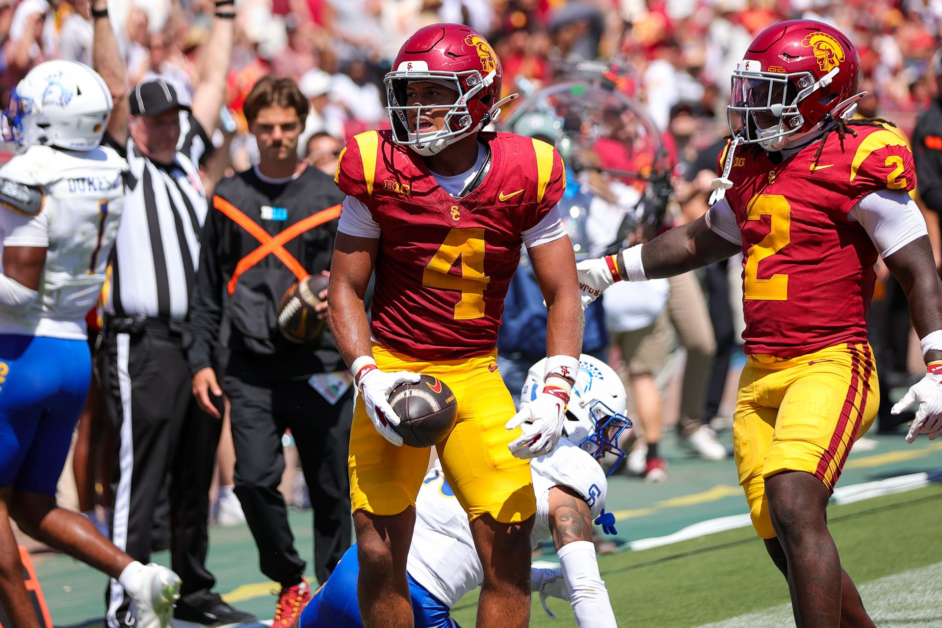 Trent Mosley (4) celebrates a touchdown for USC