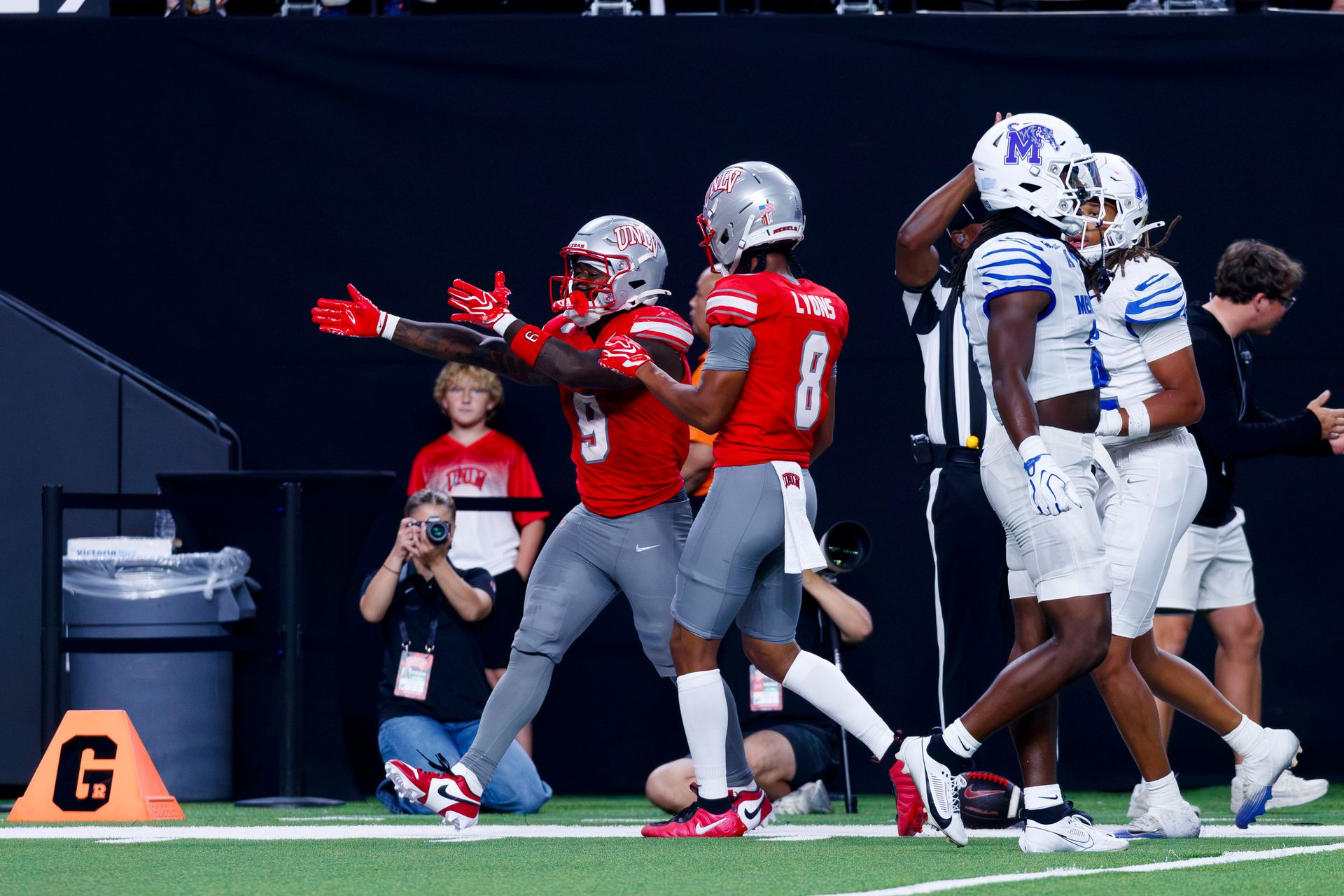 Jai’Den Thomas and Taeshaun Lyons celebrate a first down