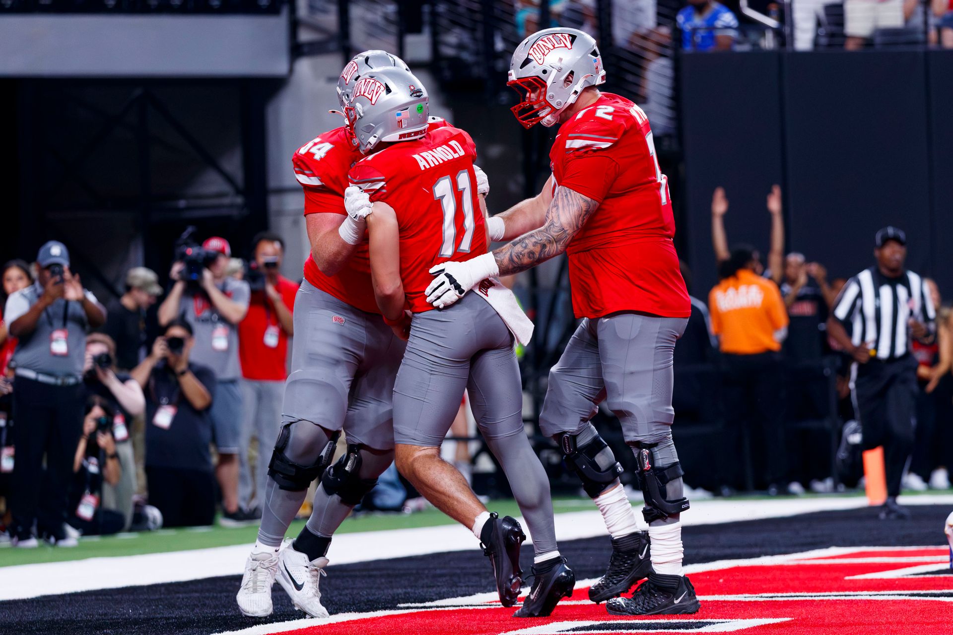 Jackson Arnold celebrates a touchdown with teammates