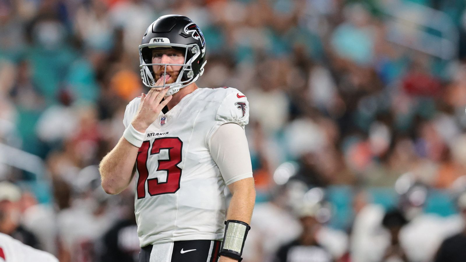 Cooper Rush looks on during Falcons vs. Dolphins game at Hard Rock Stadium