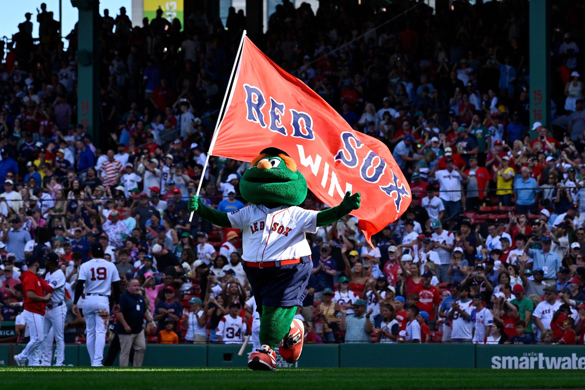 Wally the mascot celebrates Red Sox victory over the Angels at Fenway.