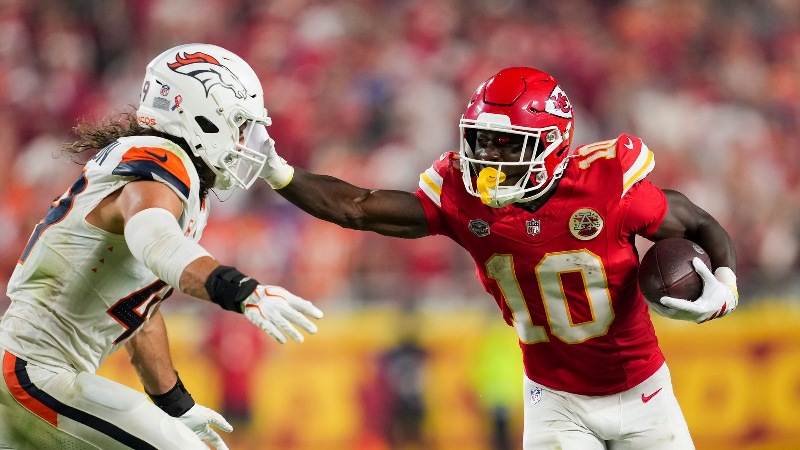 Emmett Johnson evades a tackle at Arrowhead Stadium.