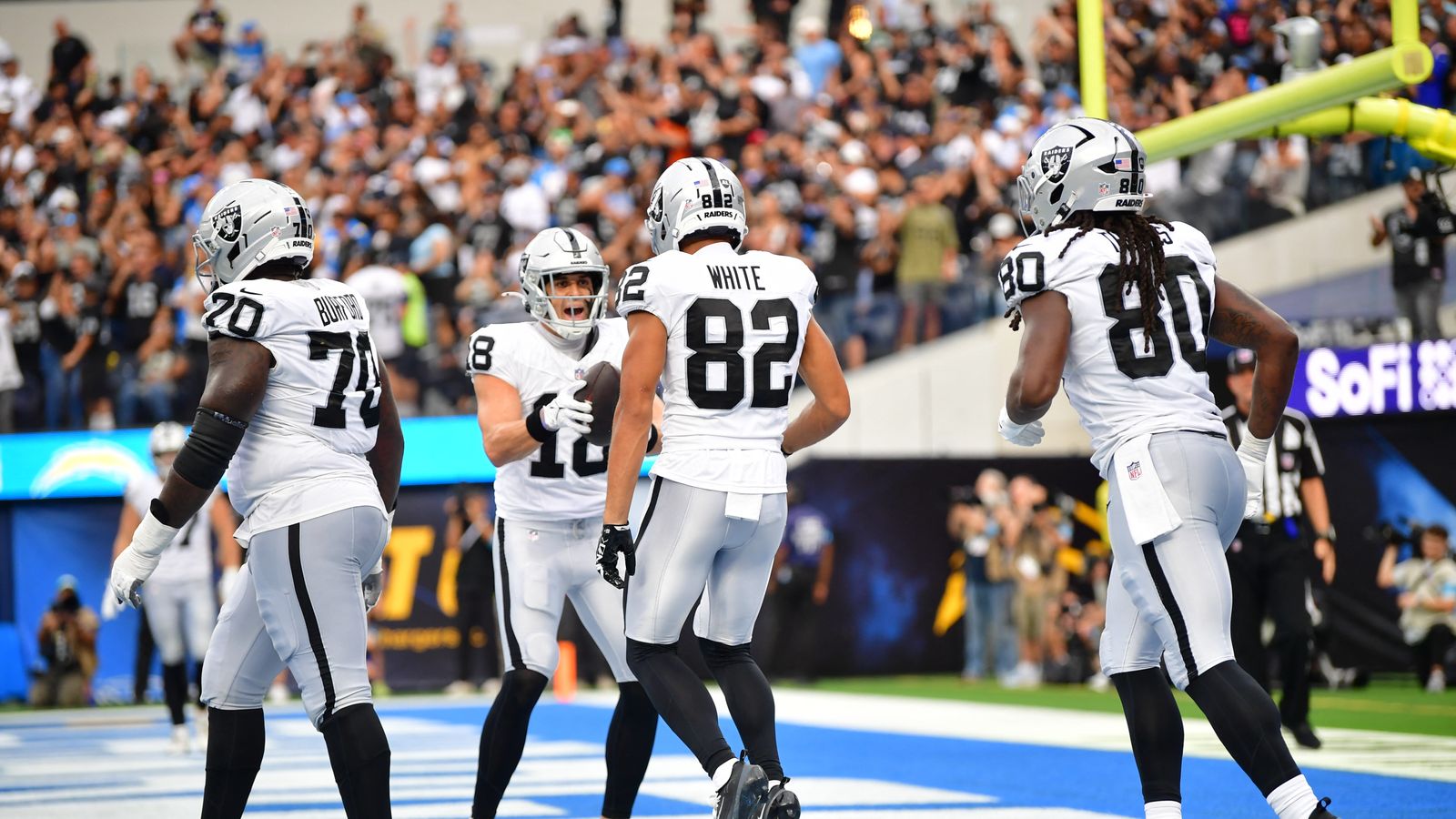 Jack Bech and Corey Rucker celebrate a Raiders touchdown at SoFi Stadium.