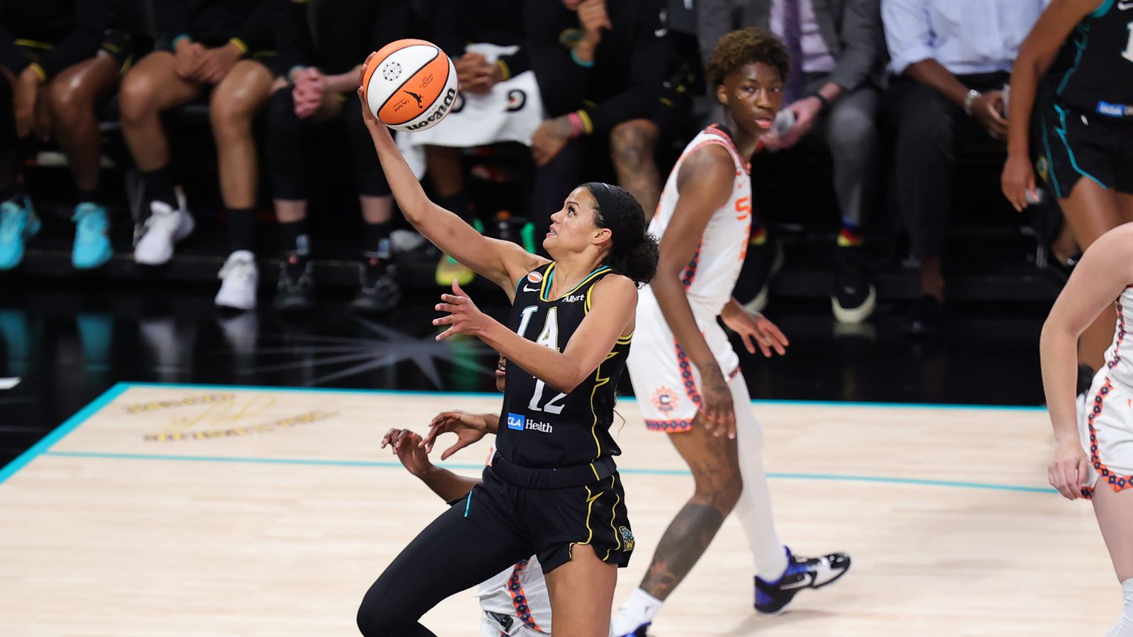 Los Angeles Sparks forward Rae Burrell shoots a layup against the Connecticut Sun.