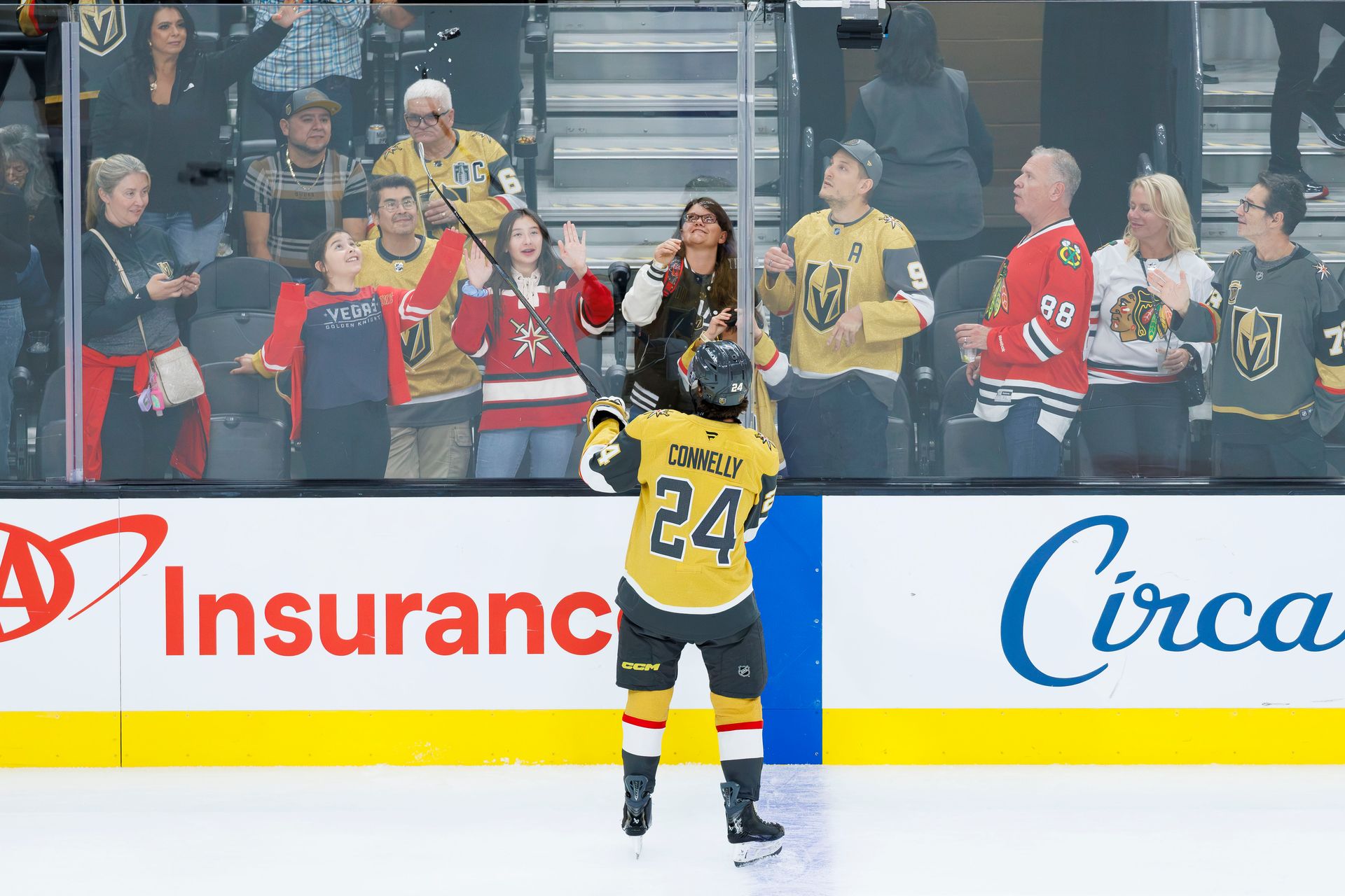 Trevor Connelly gifts a puck to a fan before the game.