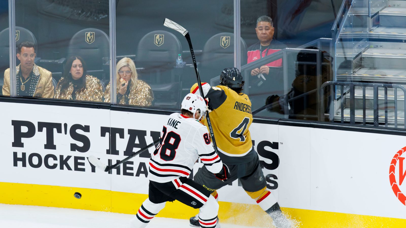 Rasmus Andersson takes a hit from Patrick Kane.