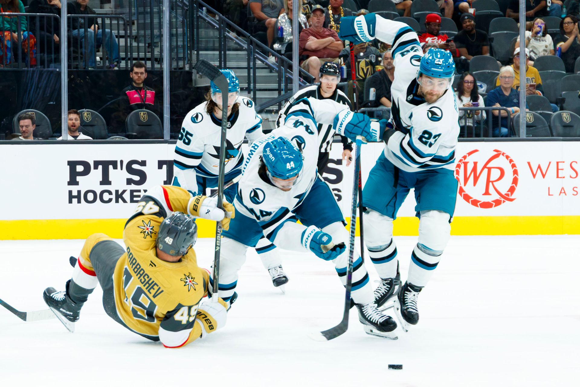 Ivan Barbashev tackled by Sharks' defenders