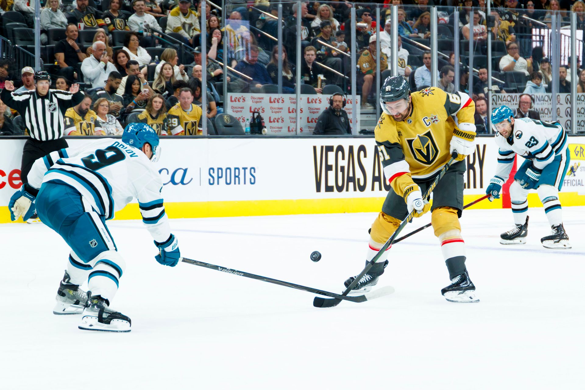Mark Stone pushes the puck down ice against Sharks