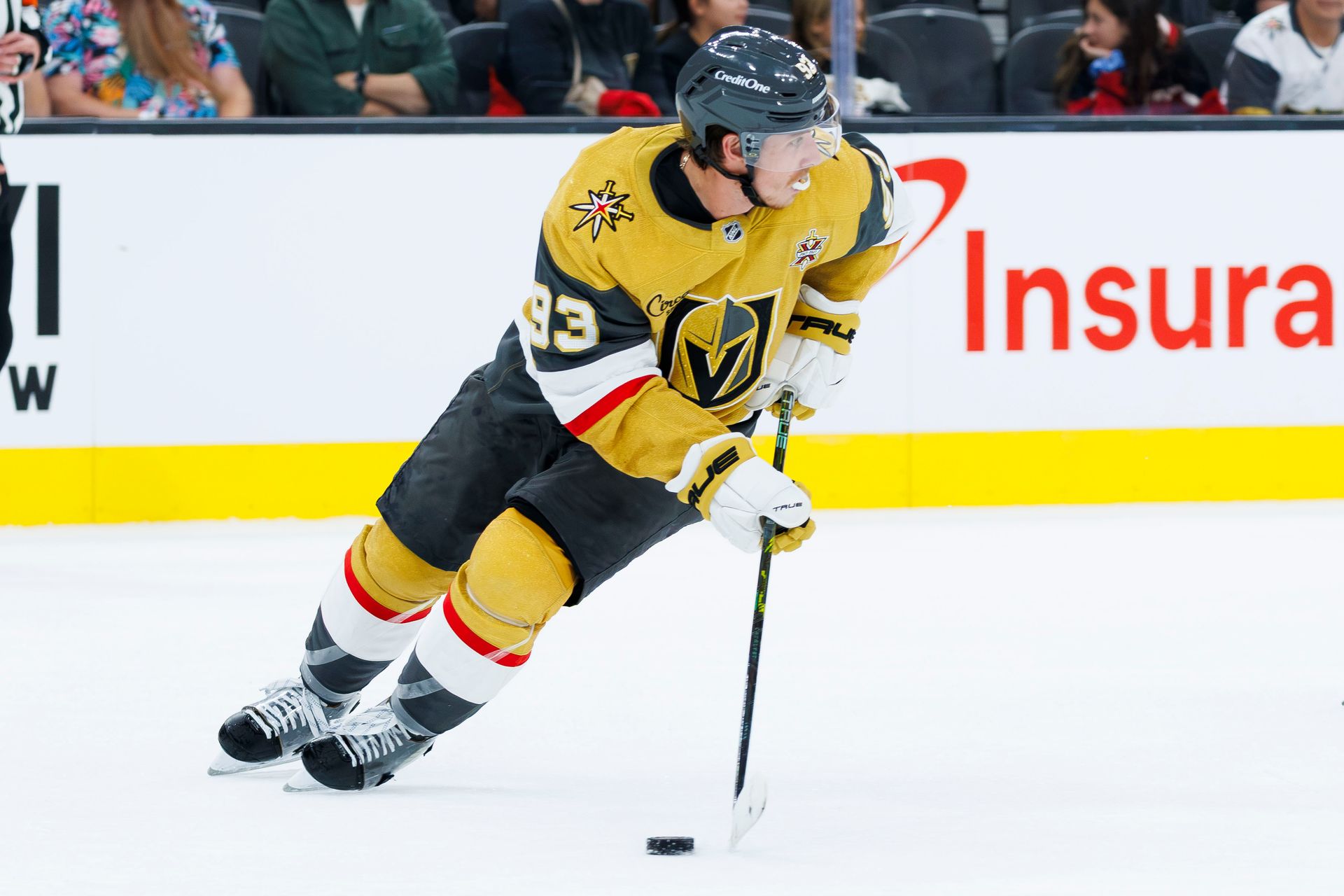 Mitch Marner maneuvers the puck in NHL game