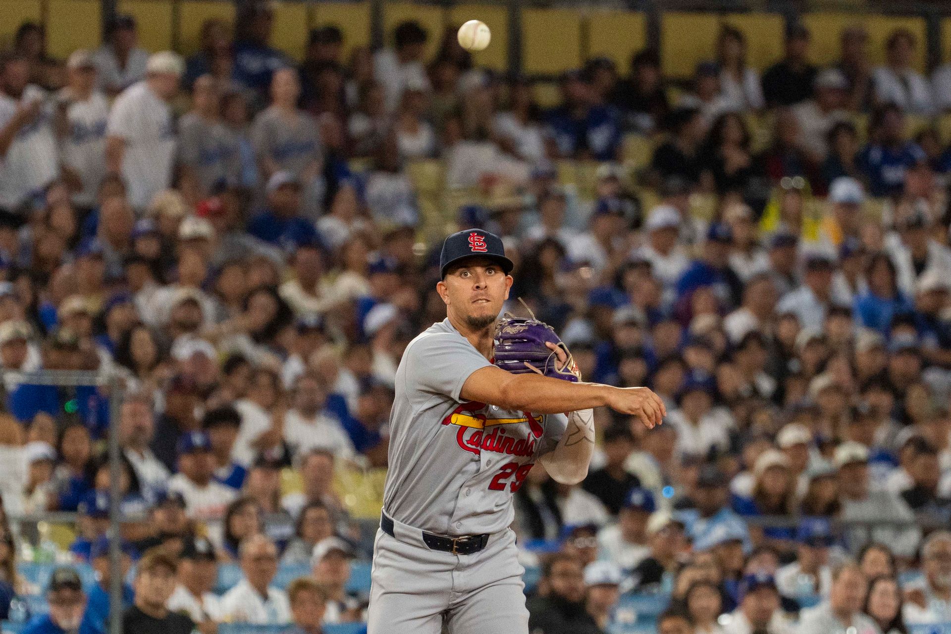 Ramon Urias makes an out at first base for the Cardinals