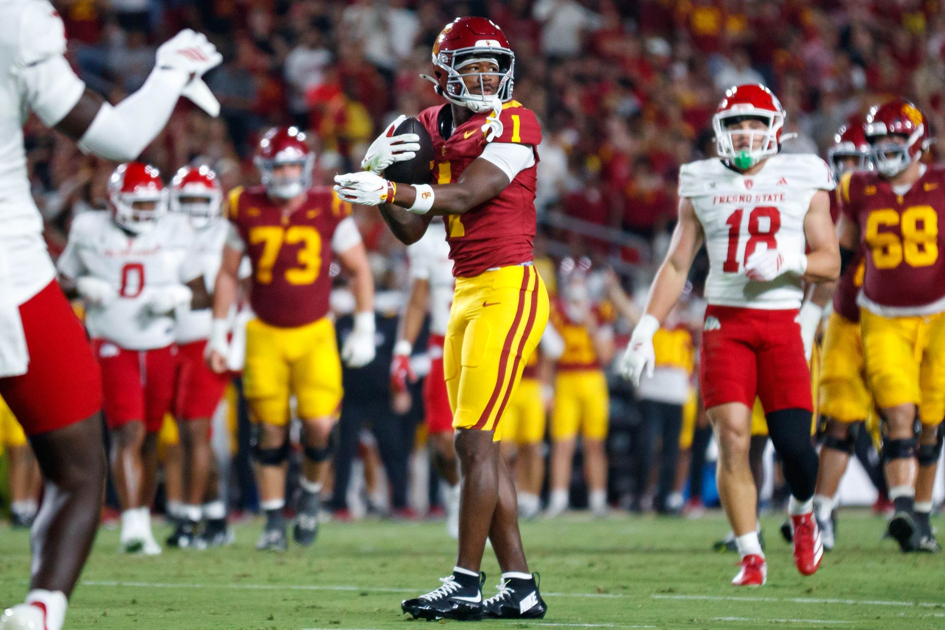 Ethan Feaster reacts to a first down for USC