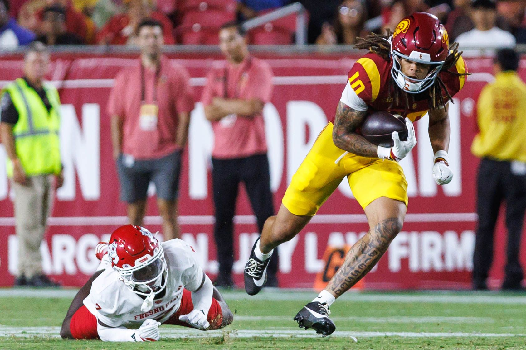 Corey Simms dodges a tackle in game against Fresno State