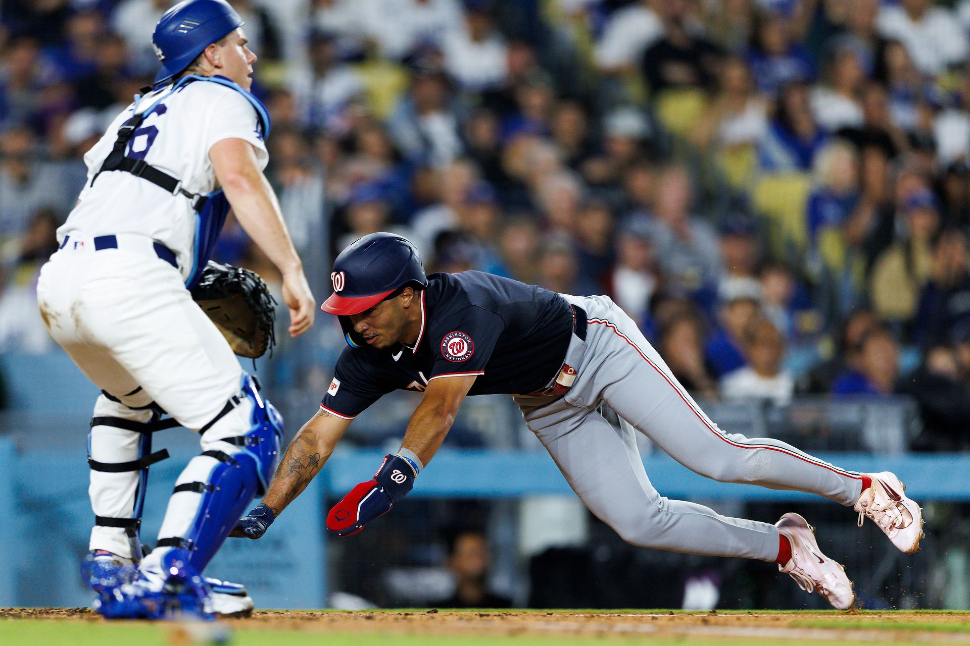 Daylen Lile slides into home plate at Dodger Stadium