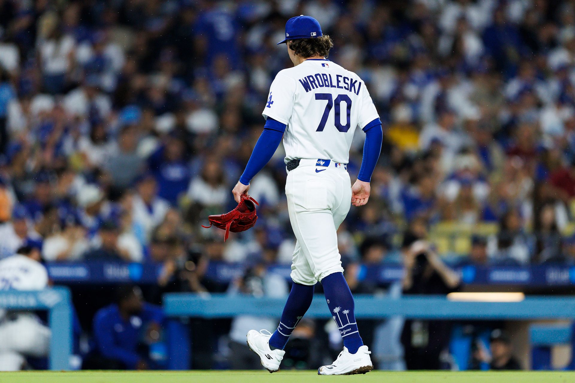 Justin Wrobleski walks off the field after the game