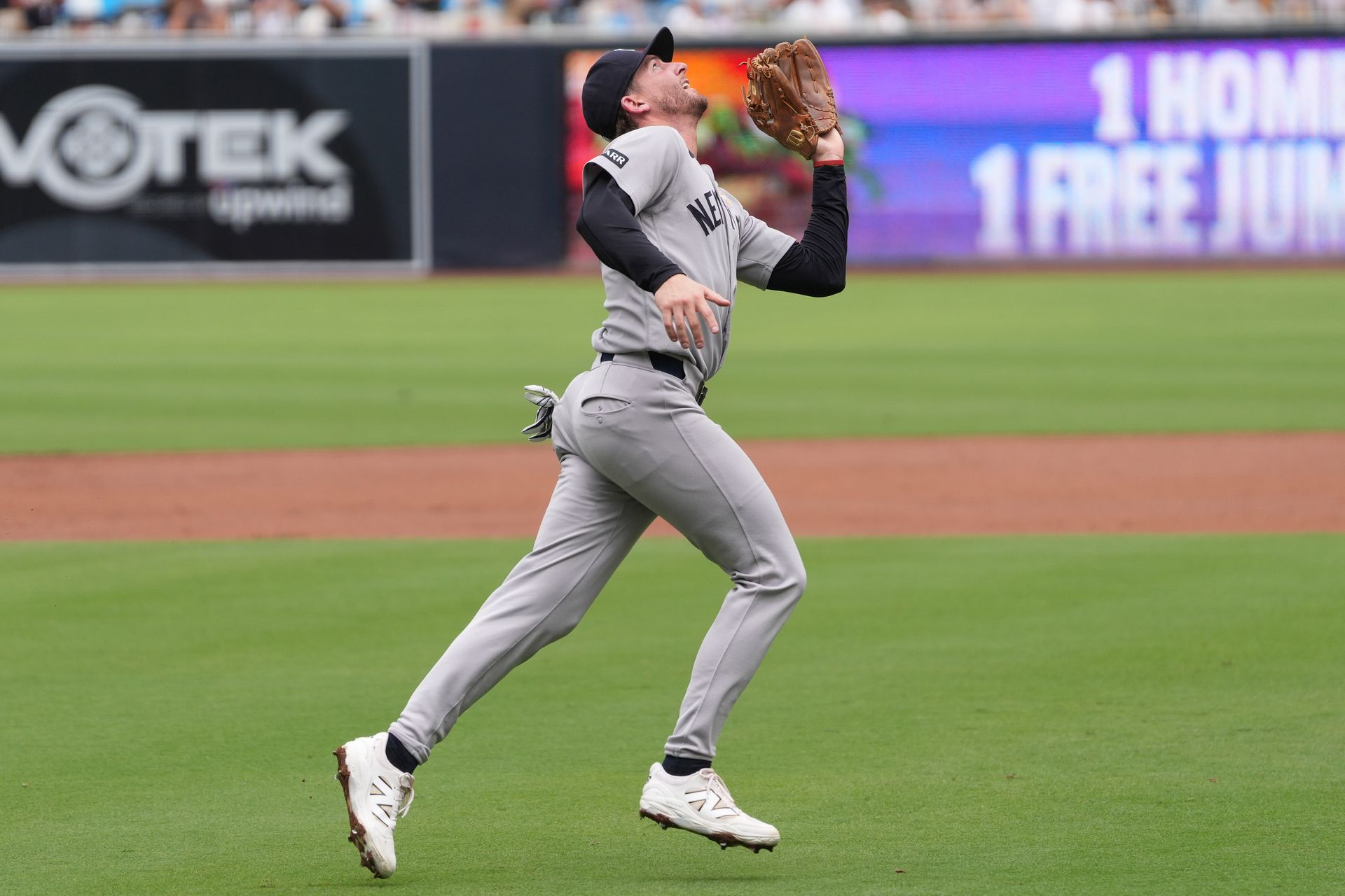 Ryan McMahon catches a pop fly against the Padres