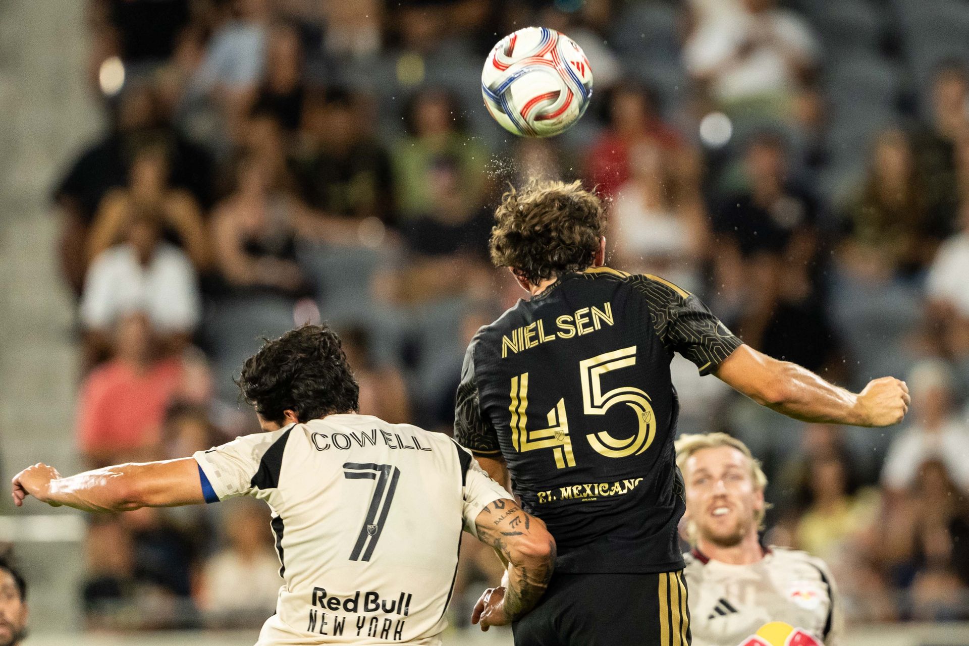 Kenny Nielsen (45) heads the ball in LAFC's match