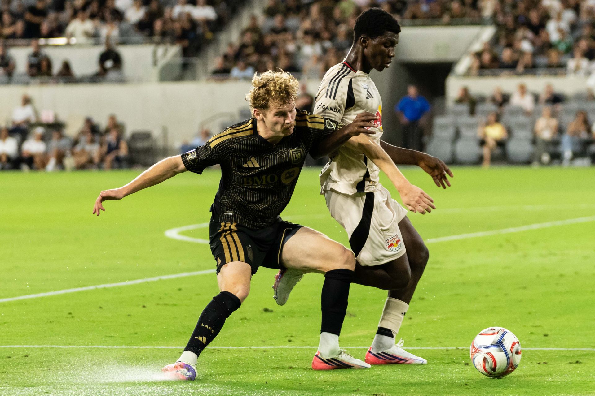 Jacob Shaffelburg (18) competes for the ball against NY Red Bulls