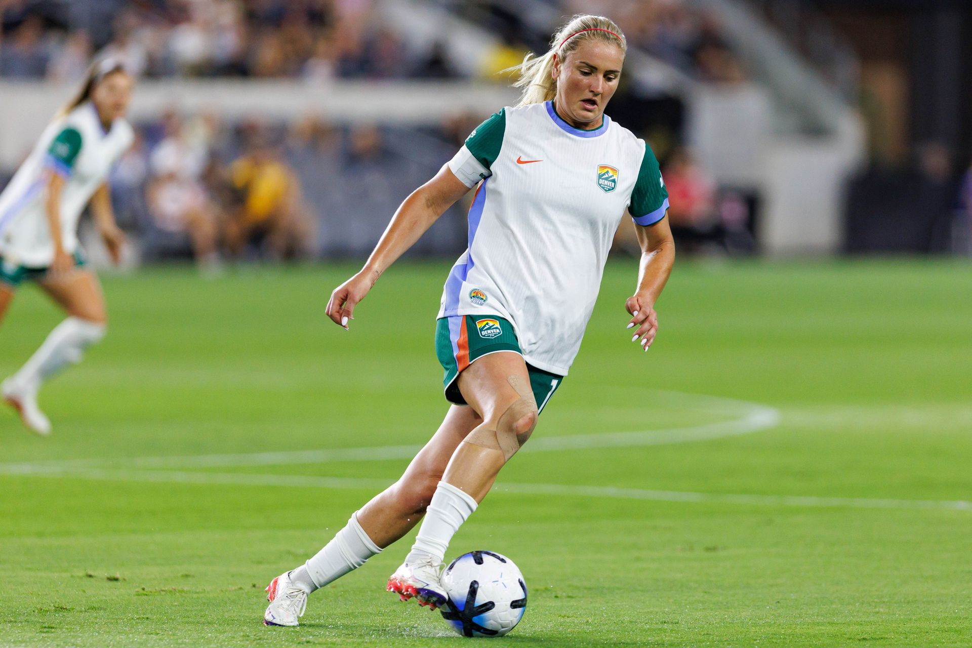 Lindsey Heaps of Denver Summit FC receives the ball in NWSL action