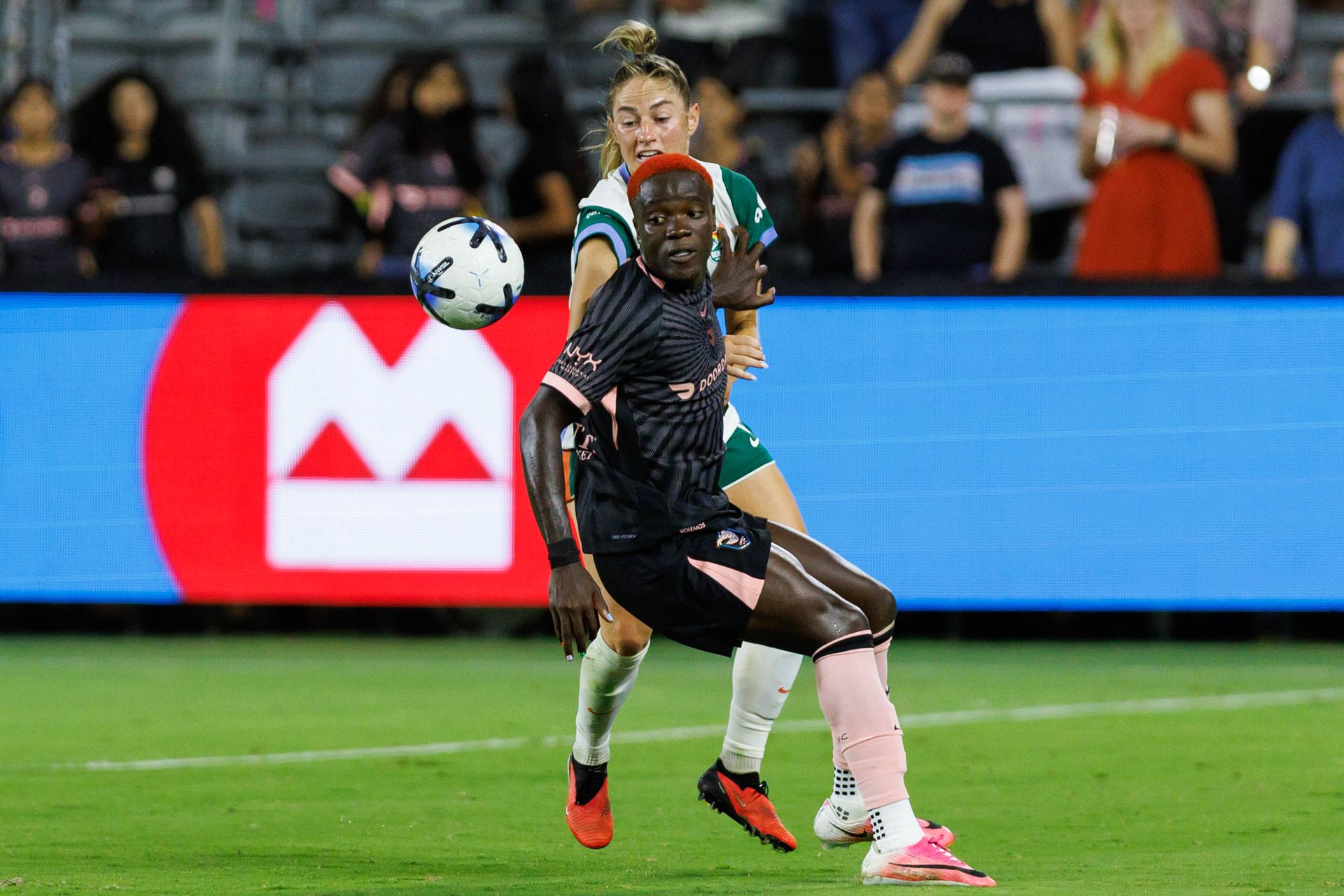 Prisca Chilufya of Angel City FC fights for possession in NWSL match