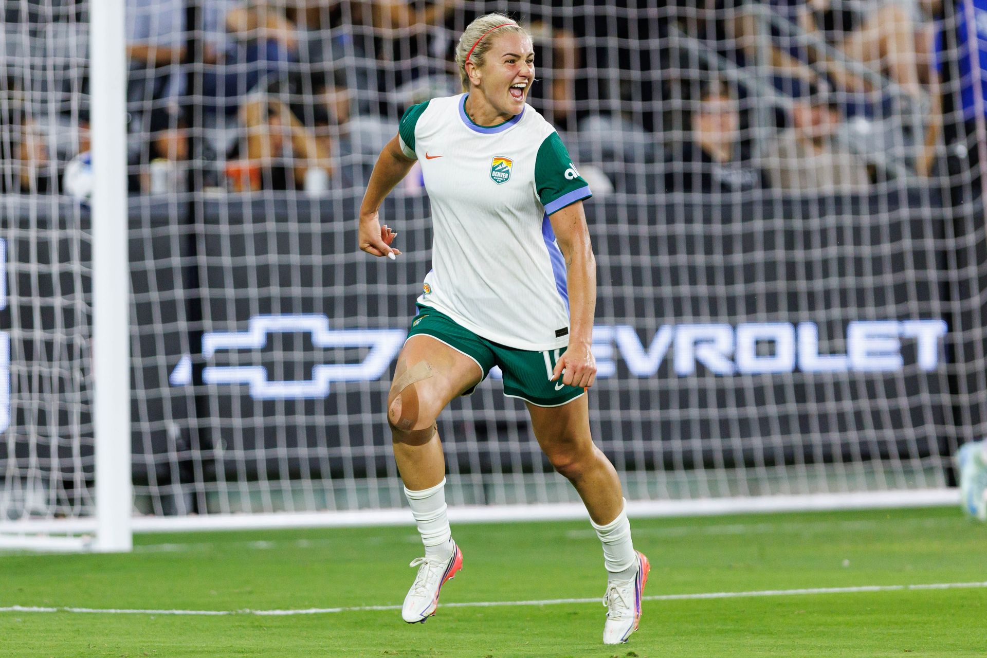 Lindsey Heaps celebrates her goal for Denver Summit FC in NWSL match