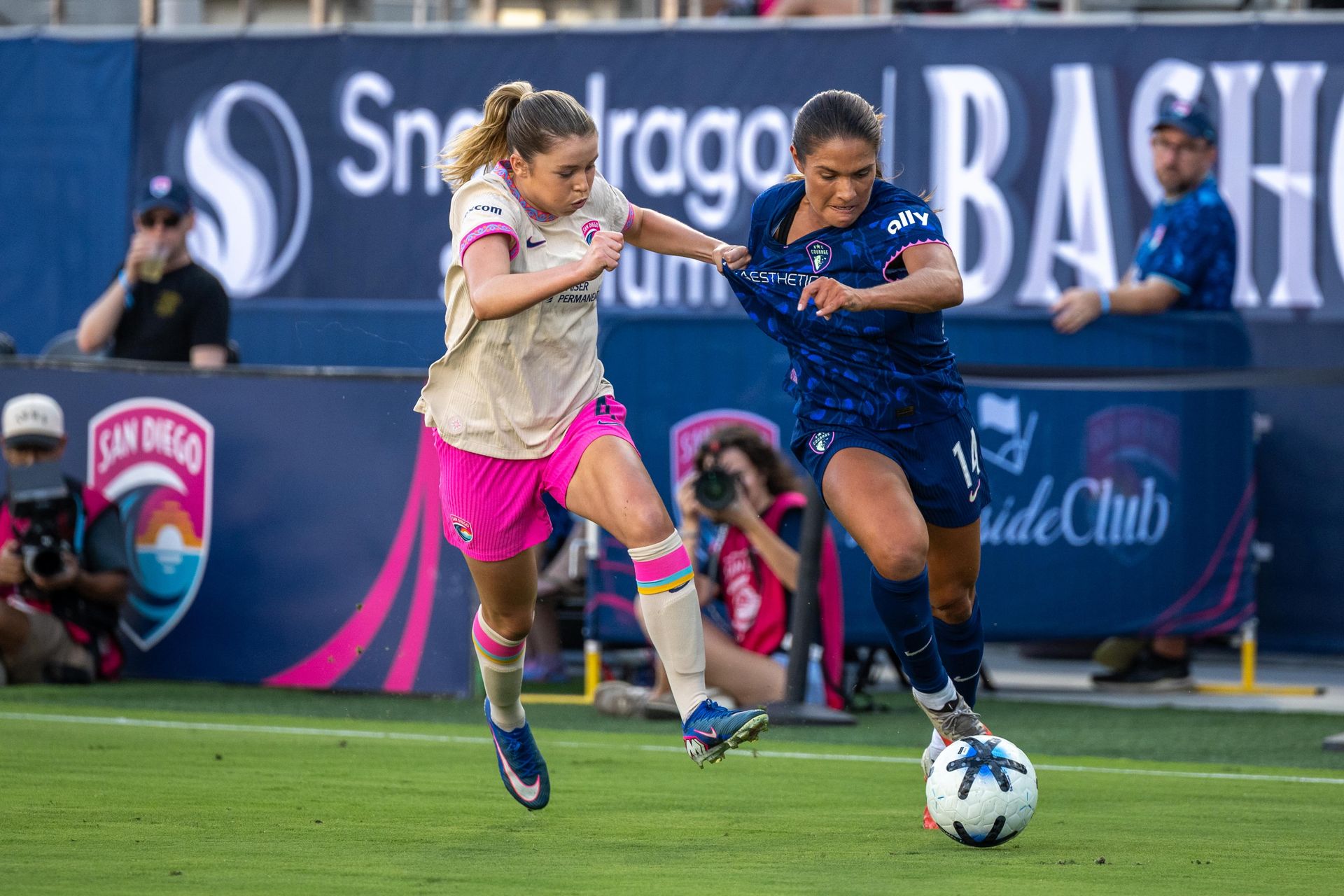 Laila Harbert battles Carly Wickenheiser for the ball