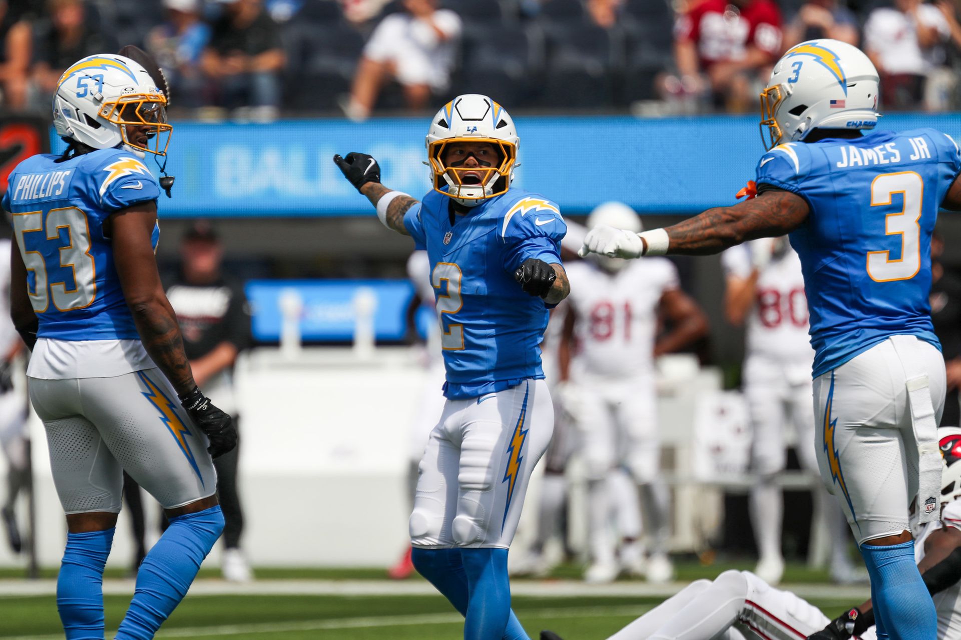 Elijah Molden celebrates a stop with Chargers teammates