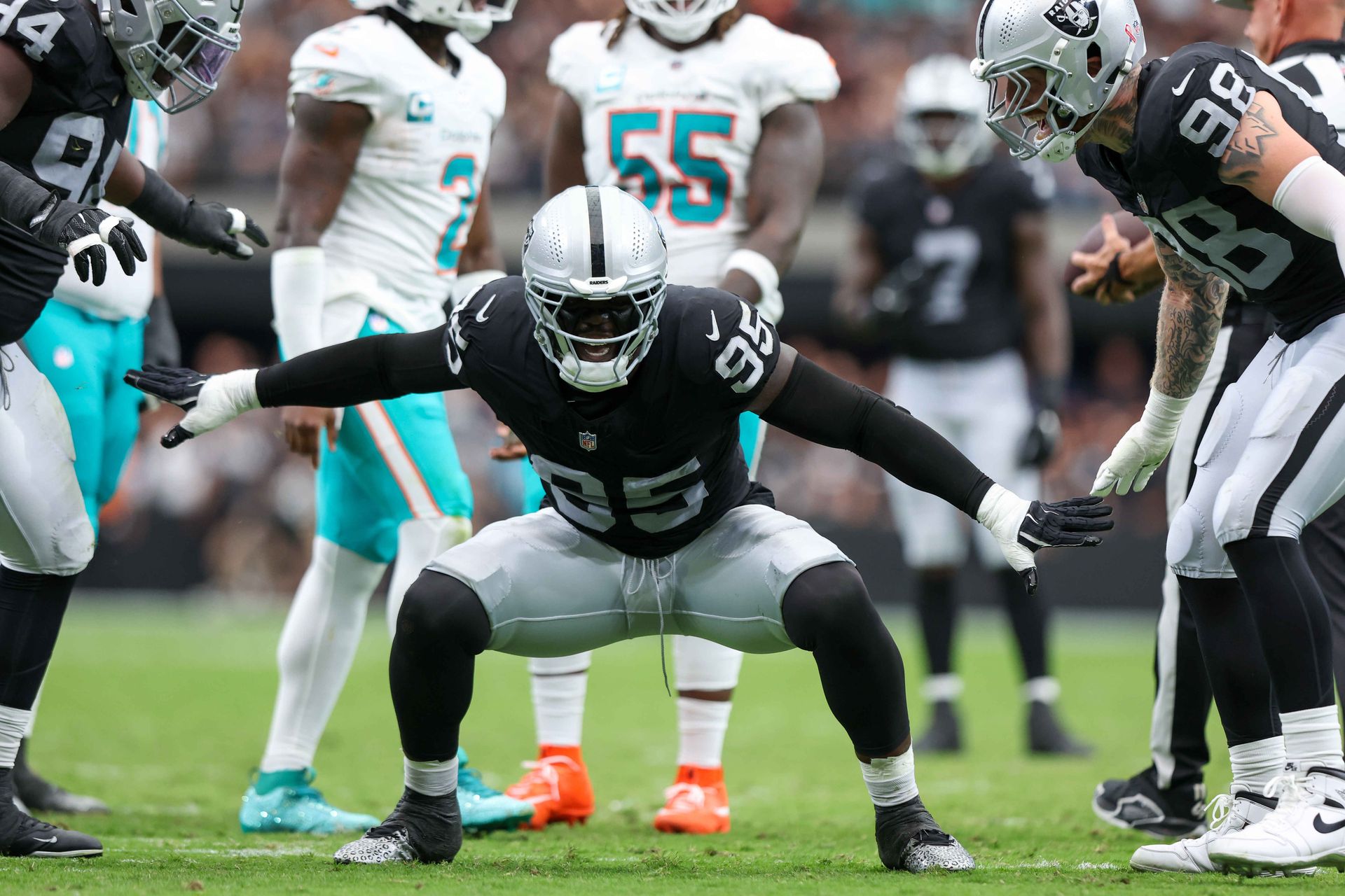 Kwity Paye celebrates a tackle in the game against the Dolphins