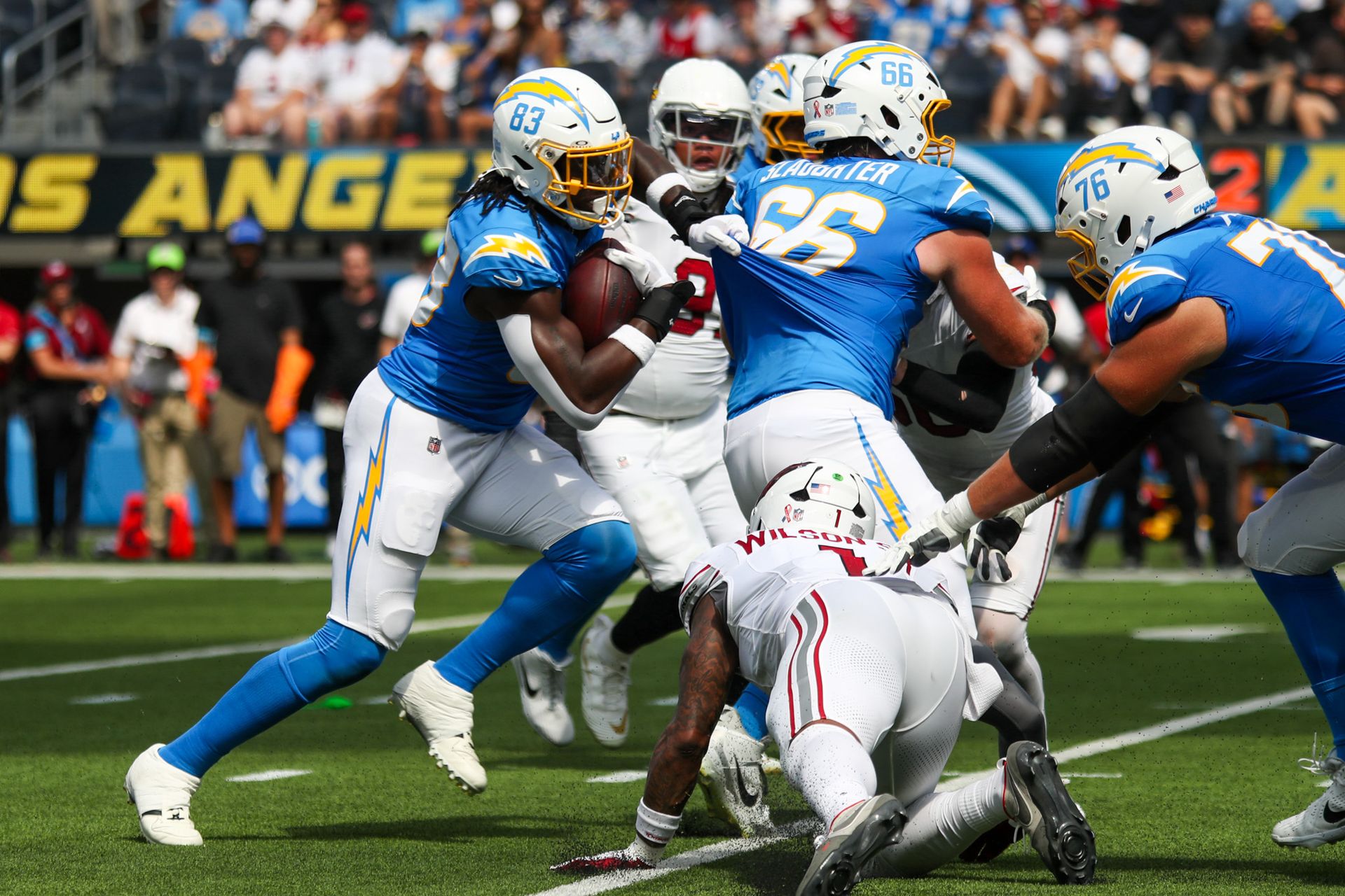 David Njoku runs with the ball for the Chargers