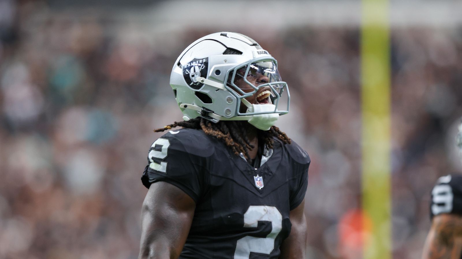 Ashton Jeanty celebrates a touchdown for the Raiders against the Dolphins