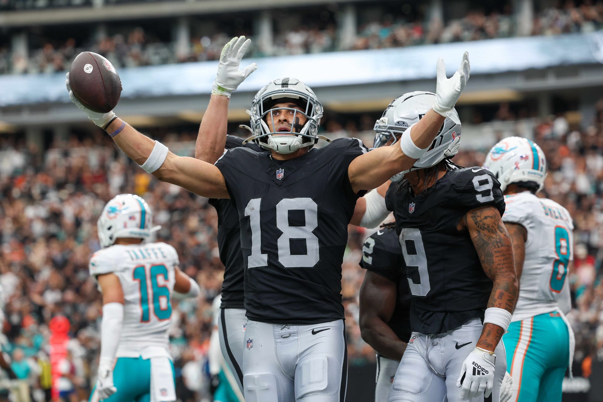 Jack Bech celebrates a touchdown against the Dolphins