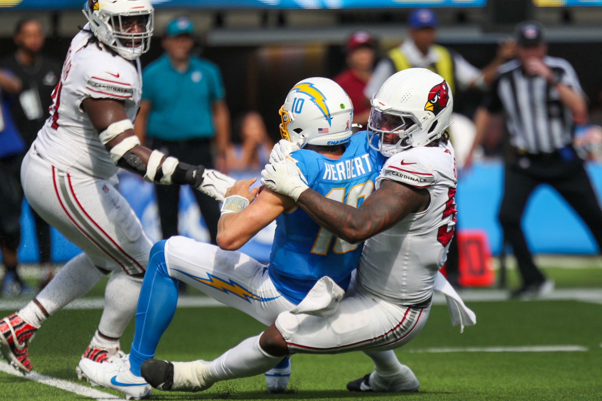 Justin Herbert sacked by Cardinals defenders