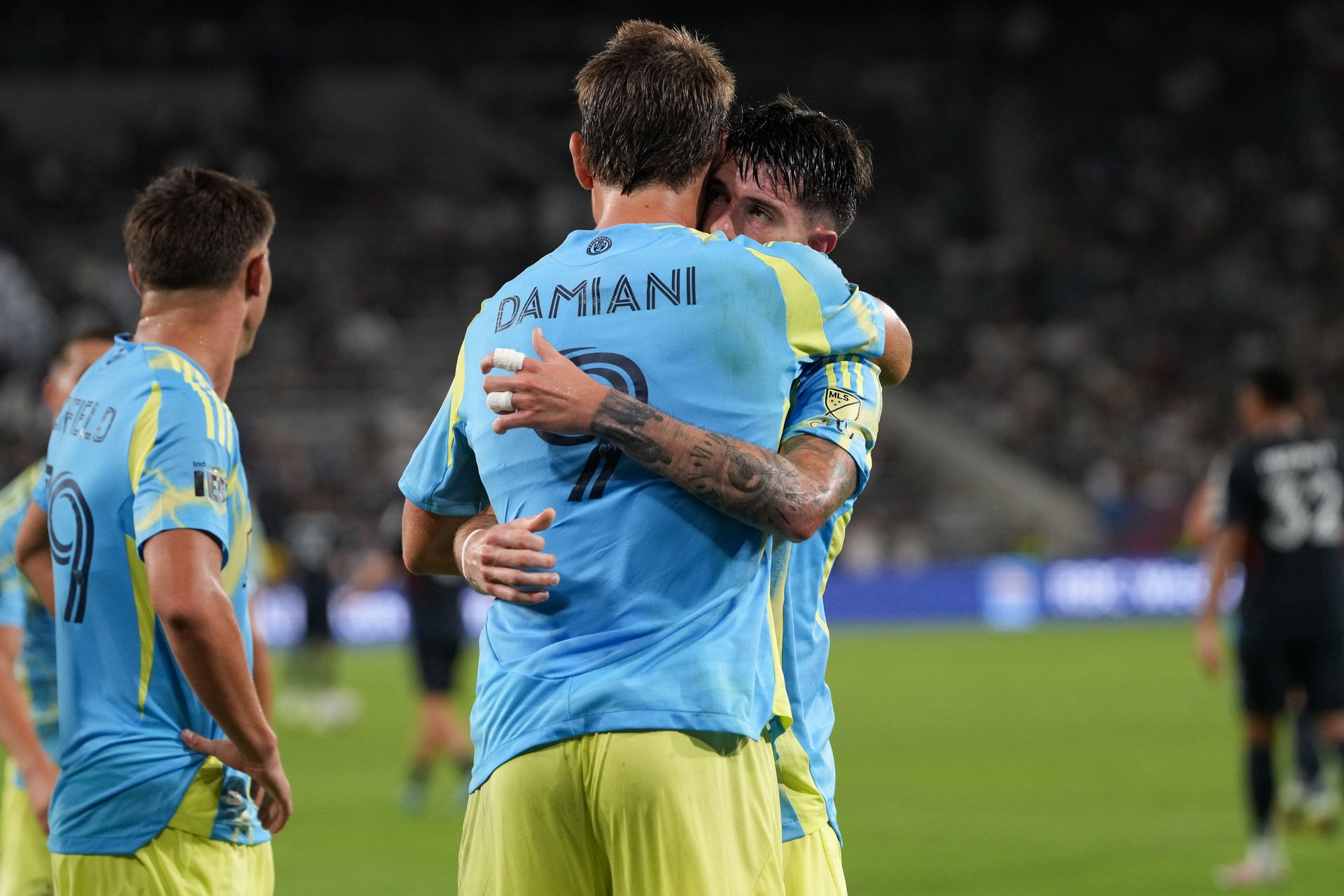 Jovan Lukic and Bruno Damiani celebrate a goal against San Diego FC