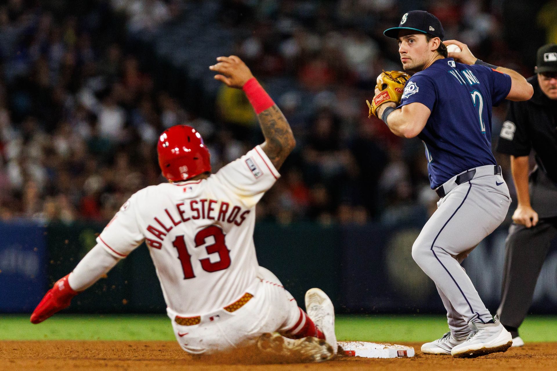 Cole Young #2 attempts a double play against the Angels.