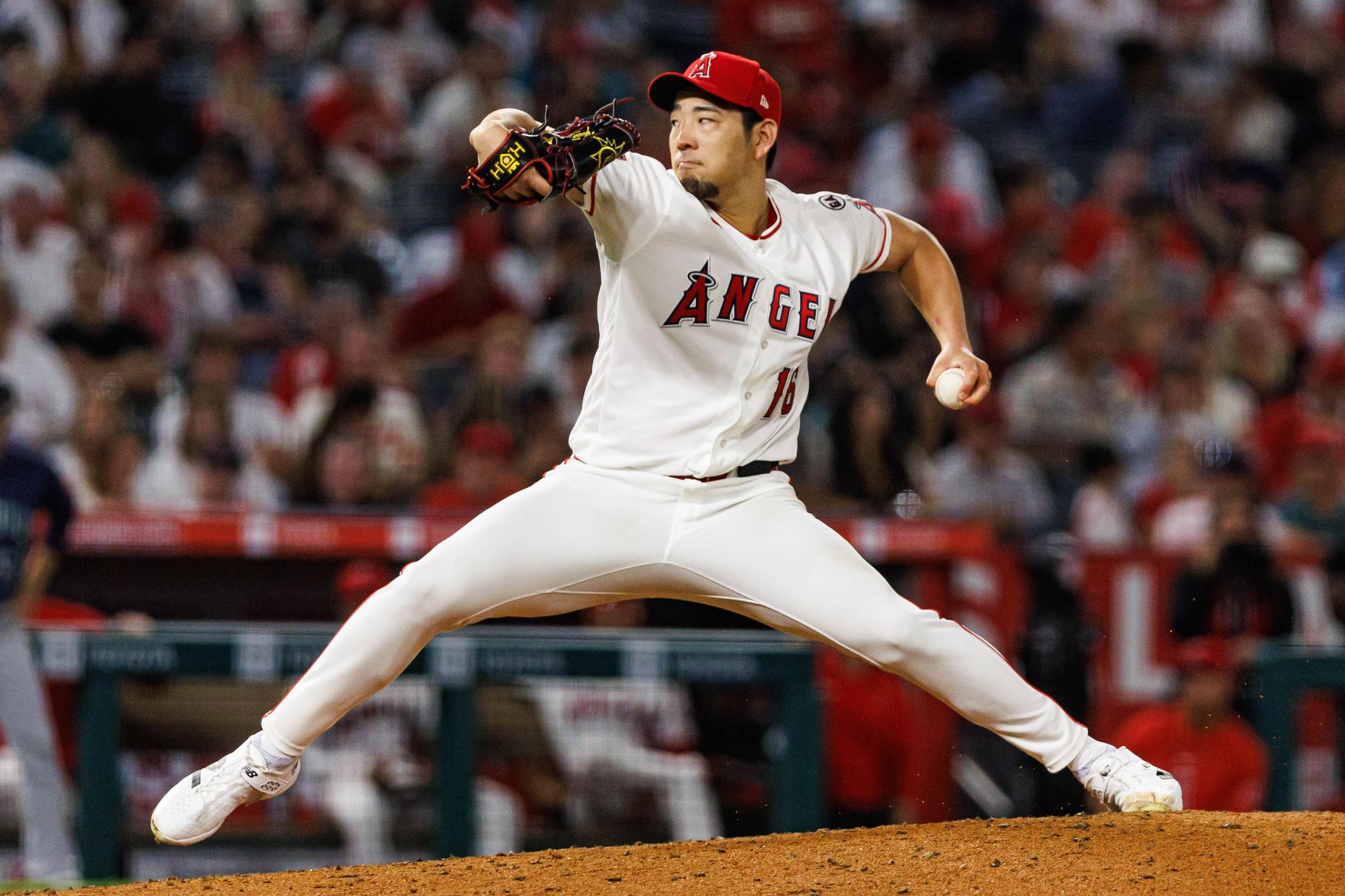 Yusei Kikuchi #16 pitches in a game against the Mariners at Angel Stadium.