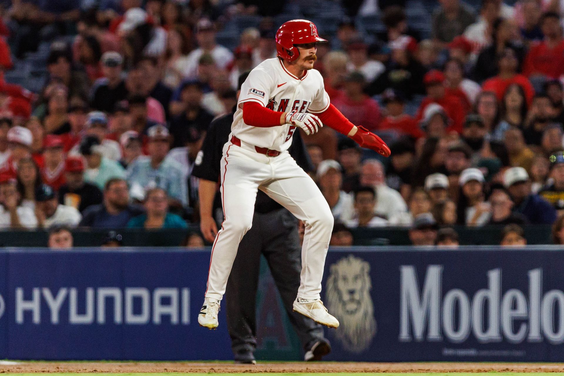 Wade Meckler #53 leaps in action during an MLB game at Angel Stadium.
