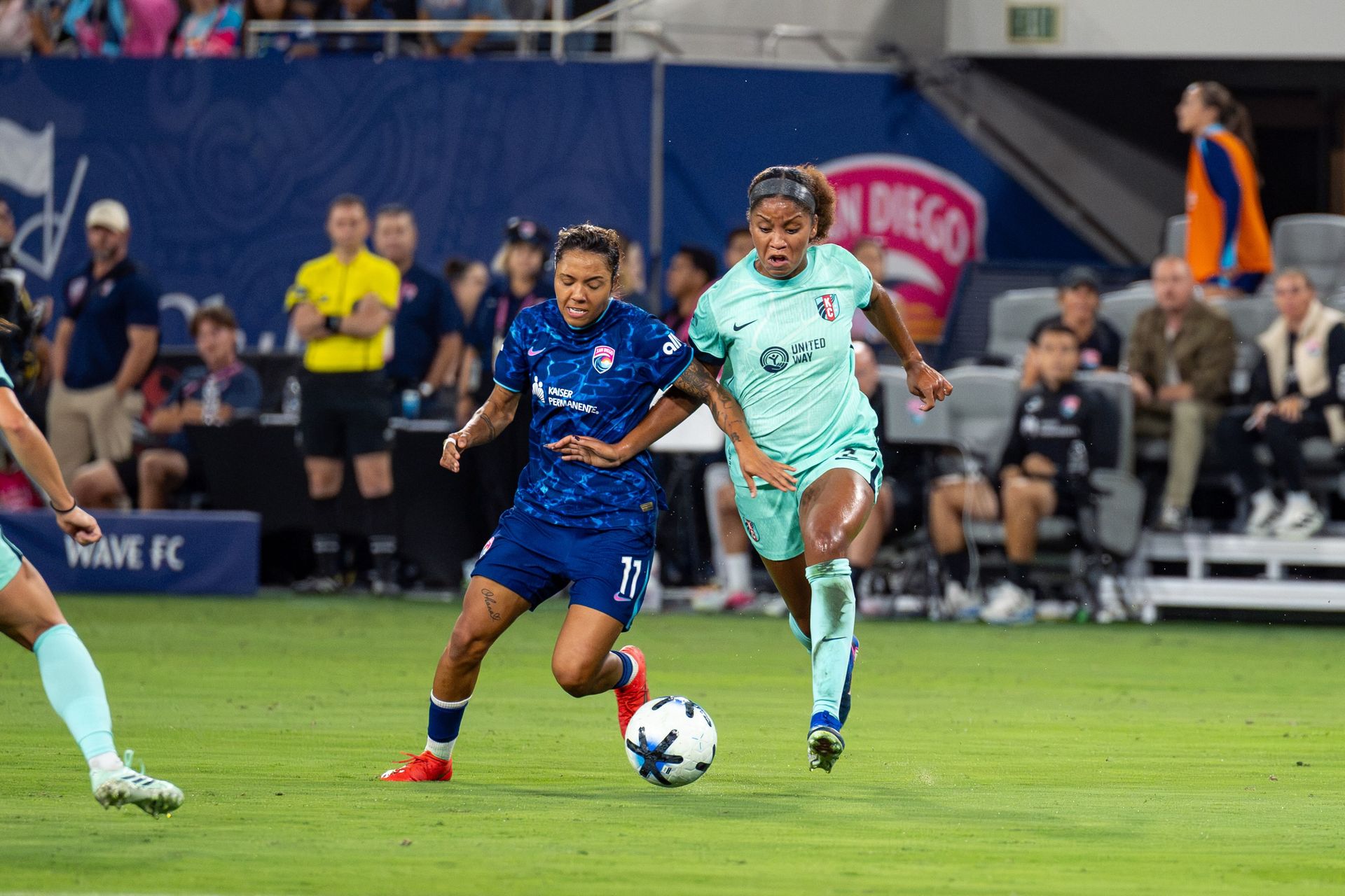 Gia Corley battles Elizabeth Ball for possession in NWSL action.