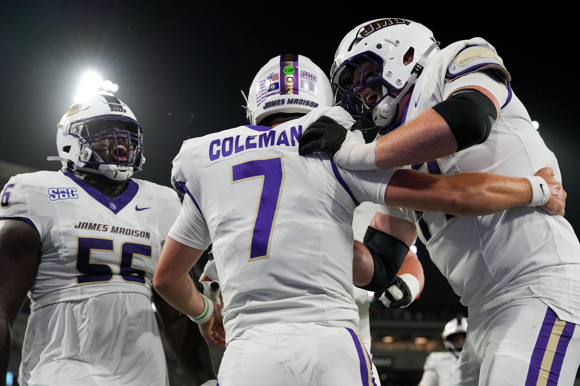 JMU's Camden Coleman with teammates after a touchdown