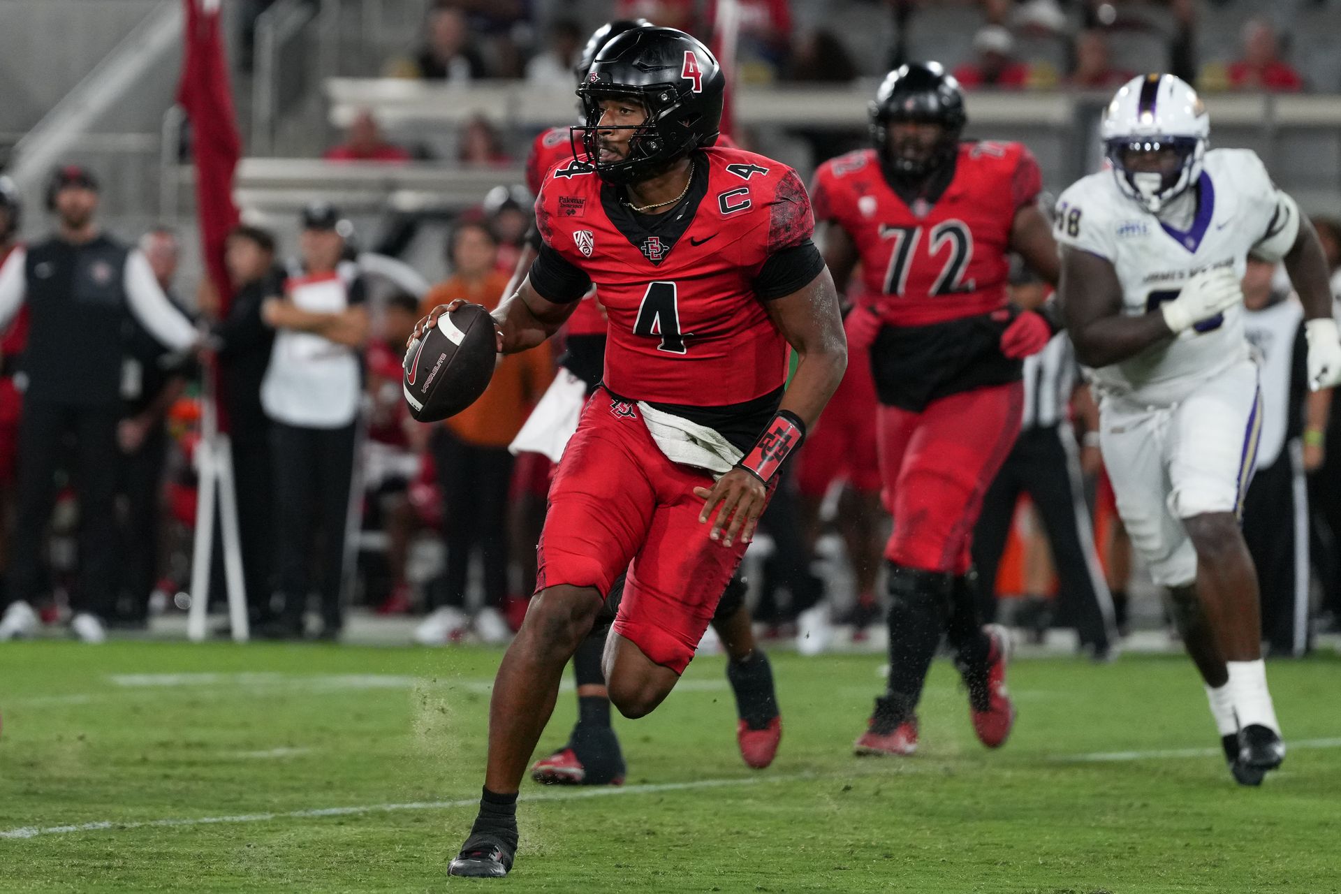 SDSU's QB Jayden Denegal scrambles against JMU
