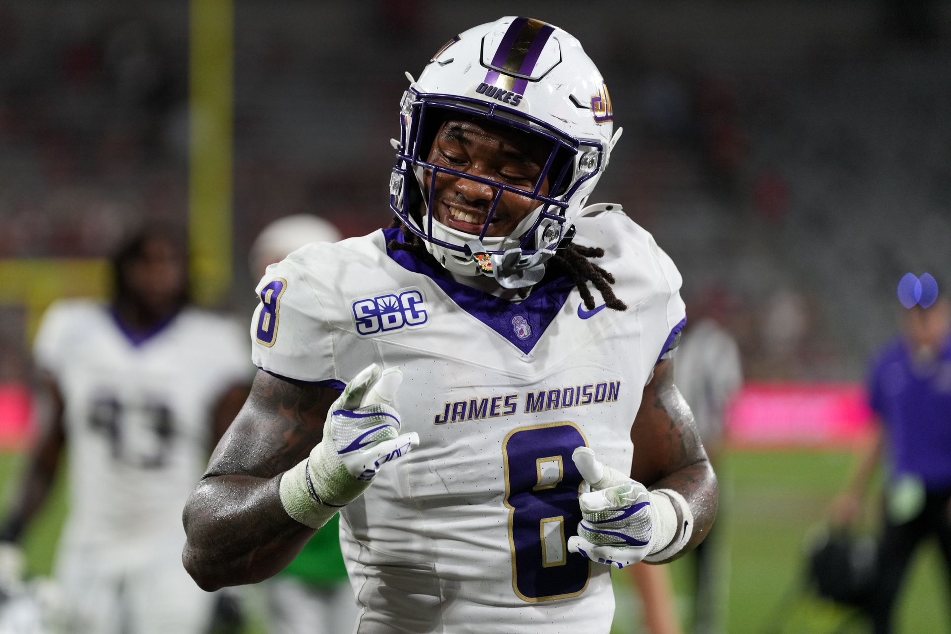 JMU's Jeremiah Harrison celebrates at halftime against SDSU