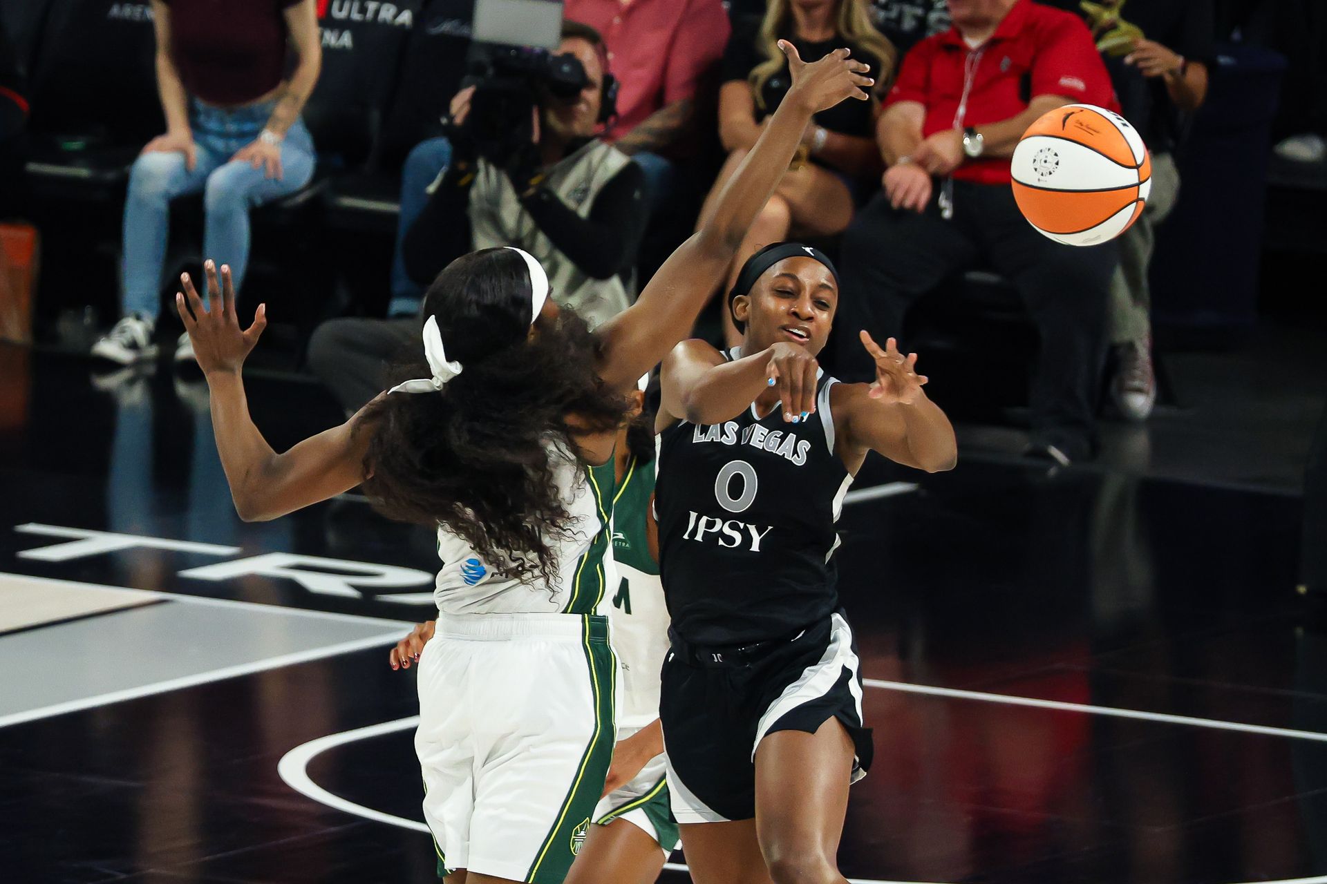Jackie Young makes a pass in the WNBA game against Seattle Storm
