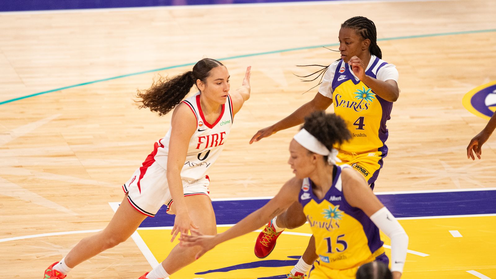 Carla Leite drives down the middle in WNBA action.