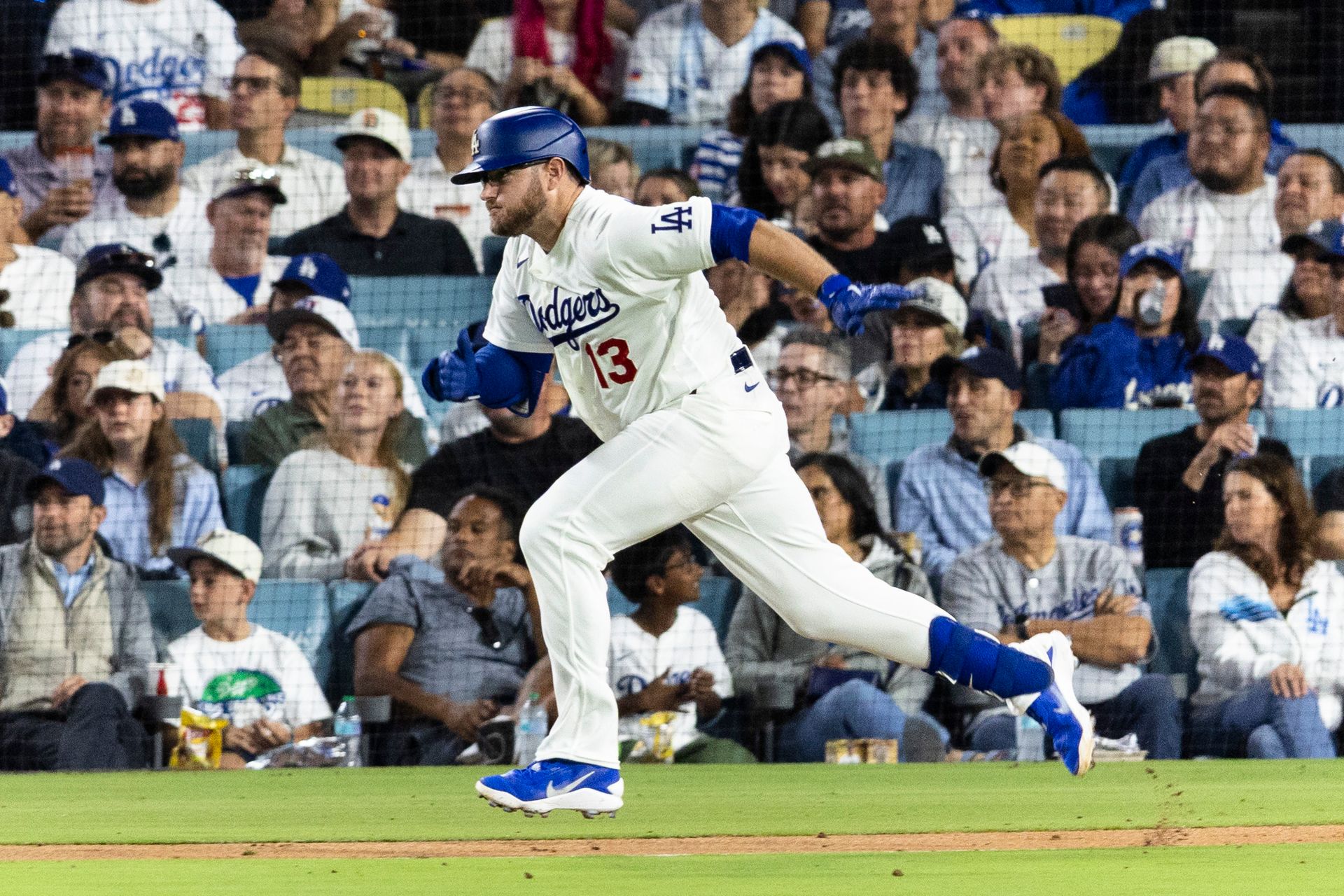 Max Muncy (13) hustles to first base in Dodgers vs. Padres game.