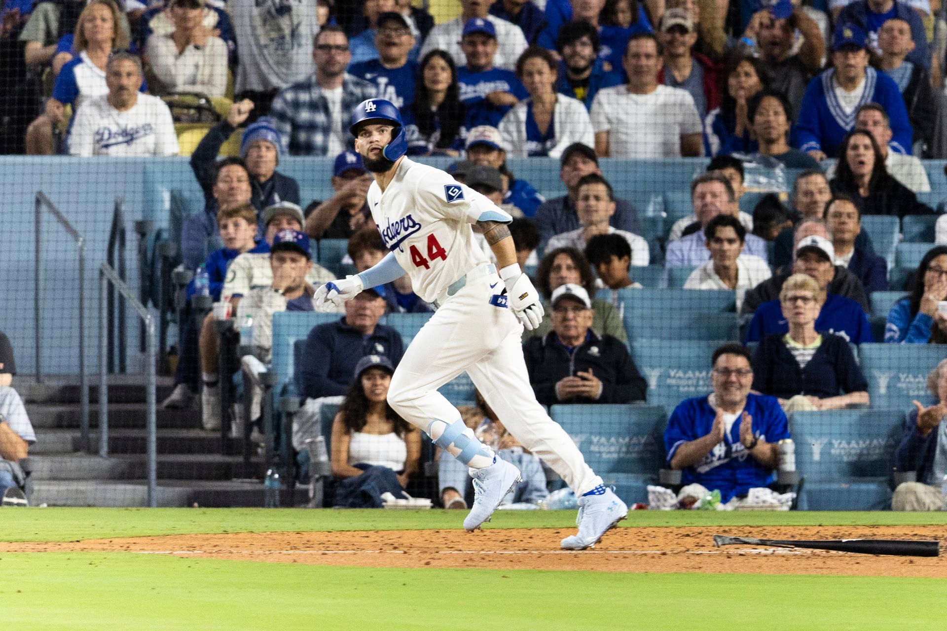 Andy Pages (44) heads to first in Dodgers vs. Padres game.