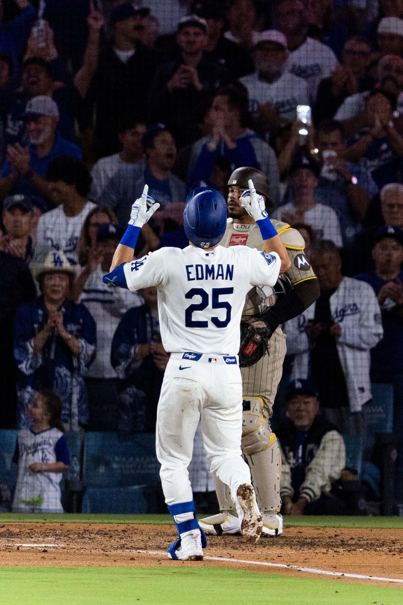 Tommy Edman (25) celebrates after a home run vs. Padres.