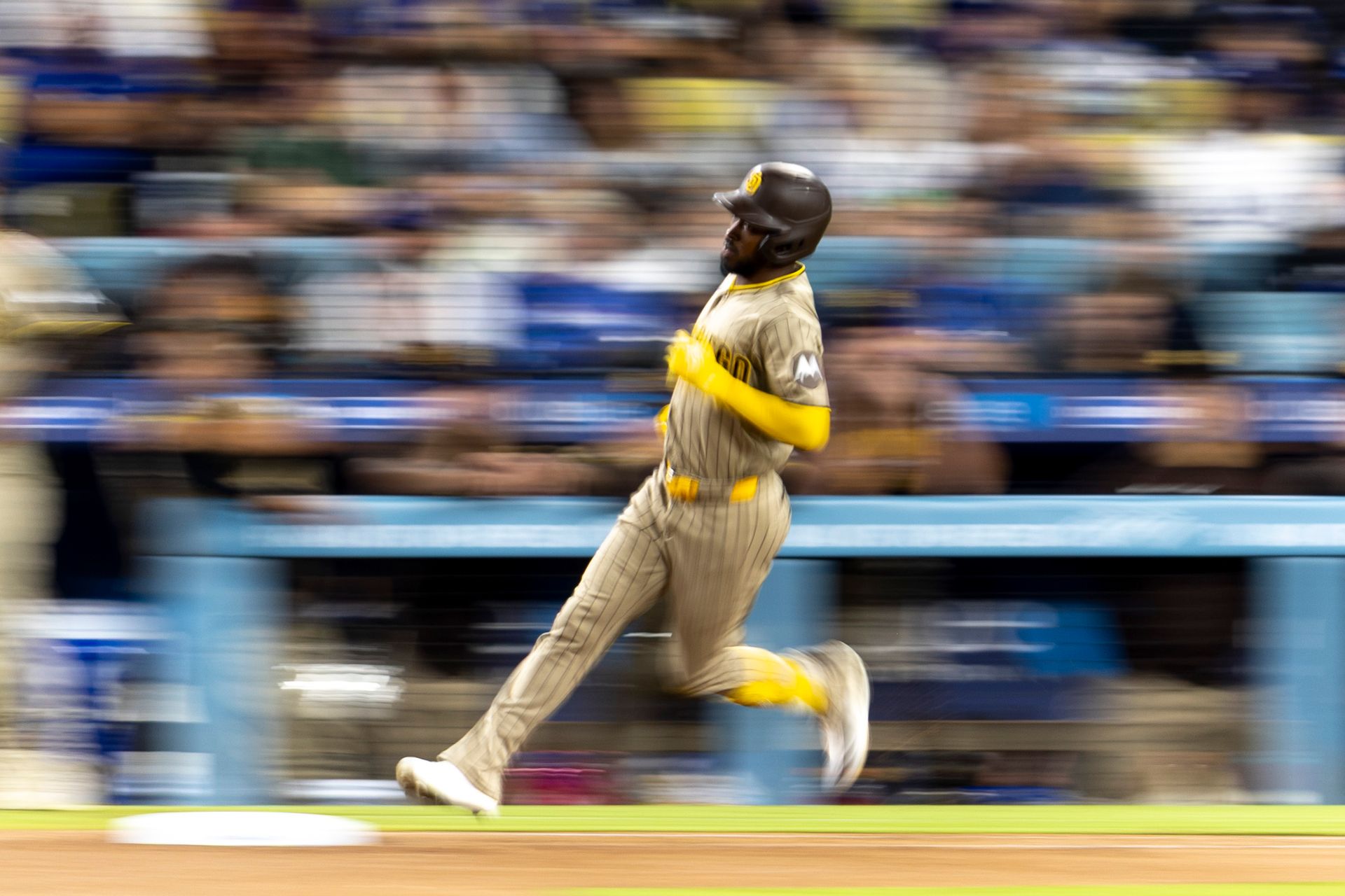 Samad Taylor (0) sprints to first in MLB game vs. Dodgers.