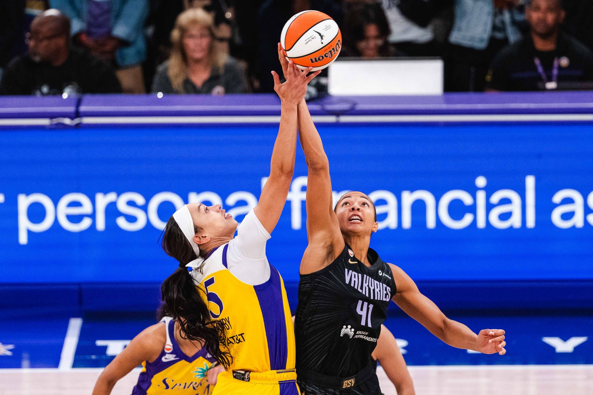 Dearica Hamby jumps for the ball in a tight WNBA game