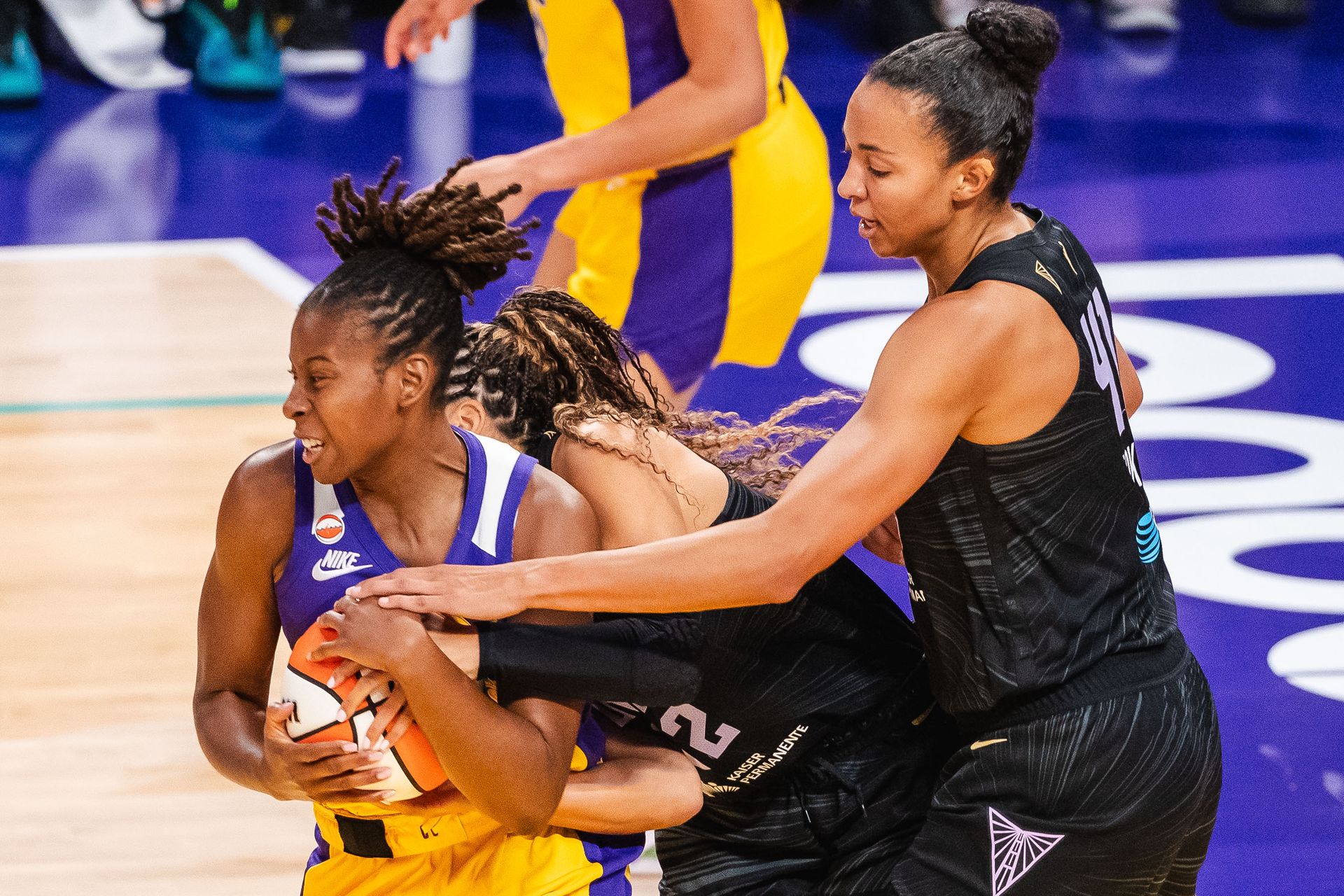 Ariel Atkins fights for the ball in WNBA competition
